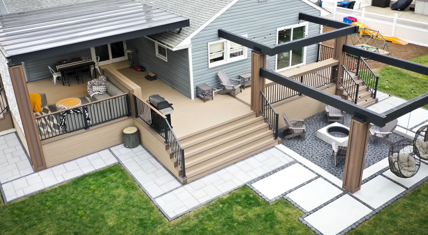 Custom multi-level deck design with modern railings and outdoor living space